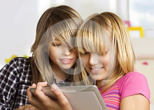 Girls using touchpad photo