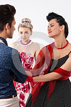 Girls in vintage dress seducing gay in presence aggravated girlfriend