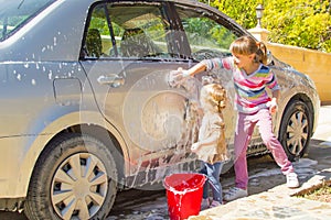 Girls washing the car