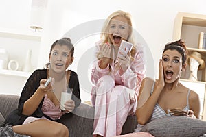 Girls watching thriller on tv photo