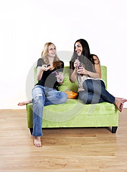 Girls watching TV laughing