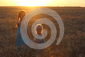 Girls on a wheat field