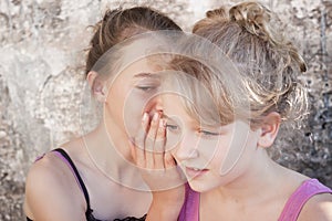 Girls whispering secrets photo