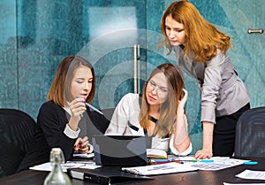 Three business women working in office