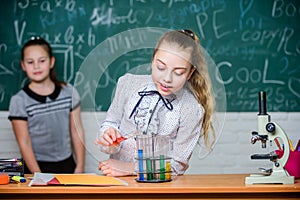 Girls working chemical experiment. Natural science. Educational experiment. School classes. Biology and chemistry