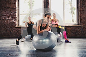 Girls working out at a gym with the gymball