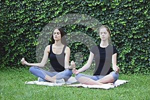 Girls yoga outside park