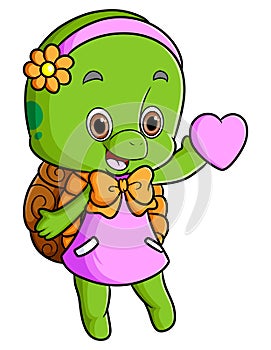 The girly turtle is wearing the dress and holding love
