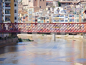 Girona City view on red the Eiffel bridge over Onyar river