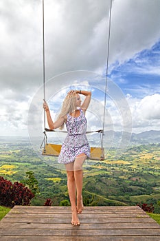 Girs posing near swing on the Redonda mountain