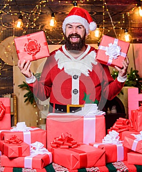Give big cheer for New Year. Bearded Santa Claus. Cheerful Santa with gifts. Man wear Santa costume. Expectancy is