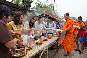 Give food offerings to a Buddhist monk in Morning