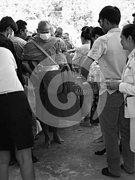 give food offerings to a Buddhist monk On the occasion of Thai Father's Day , 5 December 2023 , Buriram Thailand.