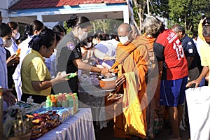 give food offerings to a Buddhist monk On the occasion of Thai Father's Day , 5 December 2023 , Buriram Thailand.