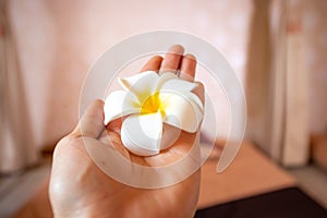 Give frangipani from left hand