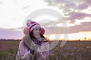Give the gift on the Day of LoveRomantic girl walking in a field in sunset light. Winter, autumn life