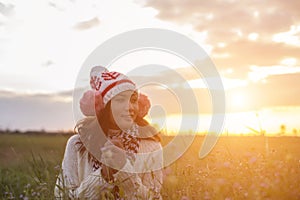 Give the gift on the Day of LoveRomantic girl walking in a field in sunset light. Winter, autumn life