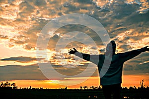 Give the gift on the Day of LoveRomantic girl walking in a field in sunset light. Winter, autumn life