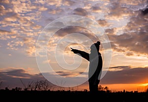 Give the gift on the Day of LoveRomantic girl walking in a field in sunset light. Winter, autumn life