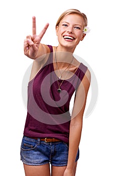 Give peace a chance. Studio portrait of an attractive young woman laughing and giving the peace sign isolated on white.