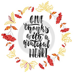 Give thanks with a grateful heart - hand drawn latin Thanksgiving Day lettering quote with autumn wreath isolated