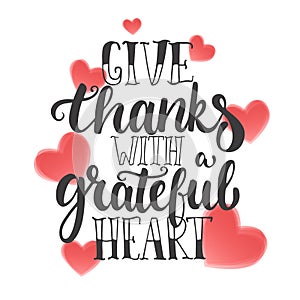 Give thanks with a grateful heart - Thanksgiving day lettering calligraphy phrase. Autumn greeting card isolated on the photo