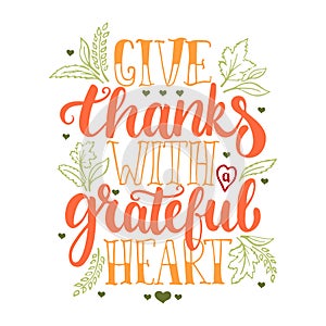 Give thanks with a greatful heart - Thanksgiving day lettering calligraphy phrase with leaves and hearts. Autumn