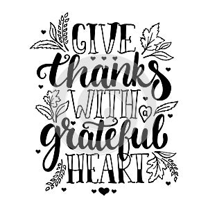 Give thanks with a greatful heart - Thanksgiving day lettering calligraphy phrase with leaves and hearts. Autumn