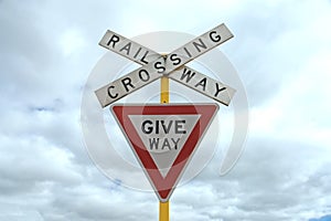 Give way railway crossing sign
