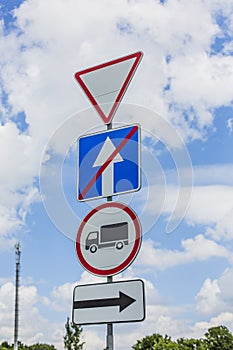 Give way, Yield Sign, the passage is forbidden for trucks, the end of one-way traffic and turn right the road signs