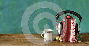 Giving audio books for christmas with christmas decoration, vintage headphones and cup of coffee.Gift,present,christian holiday co