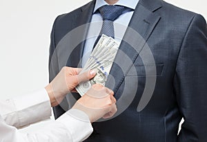 Giving a bribe into a pocket