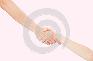 Giving a helping hand isolated on pink background, female hand