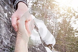 Giving a helping hand. Snow in the mountains