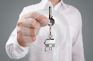 Giving house key on keychain photo