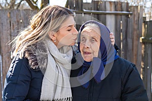 Giving a kiss to grandma