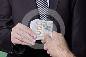 Giving money to a person. Giving bribe
