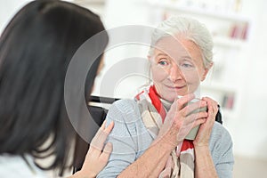 Giving old lady coffee