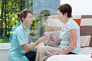 Giving patient a glass of water