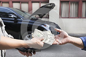 Giving and taking money for car