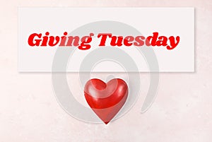 Giving Tuesday concept on pink background
