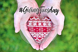 Giving Tuesday concept with red heart in hands