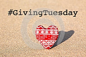 Giving Tuesday concept with red knitted heart