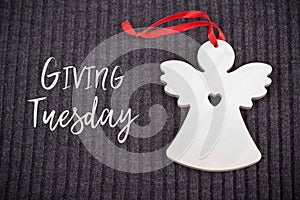 Giving Tuesday concept with Wooden Angel