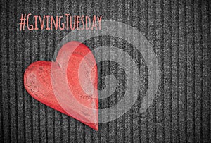 Giving Tuesday concept with wooden red heart