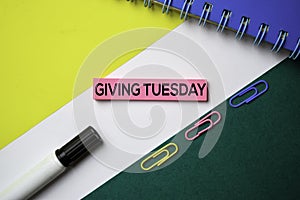 Giving Tuesday text on sticky notes with office desk concept