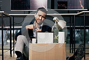 Giving up is the only sure way to fail. a young businessman looking depressed after being retrenched from work in a