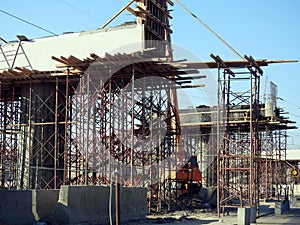 Giza, Egypt, January 7 2024: A construction site of a new bridge that is under construction with a mobile crane and workers, Egypt