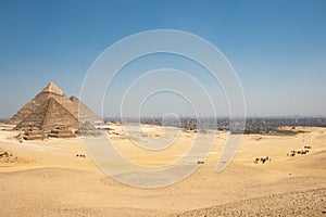 The Giza pyramid complex, also called the Giza Necropolis and Cairo Behind