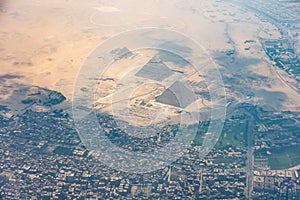 The Giza pyramid complex, also called the Giza Necropolis viewed from airplane window